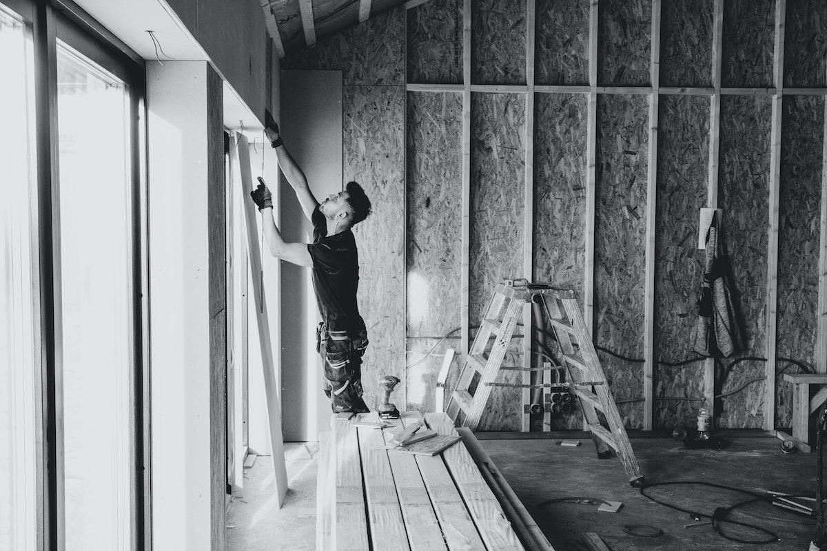 Man-doing-construction-work-inside-house